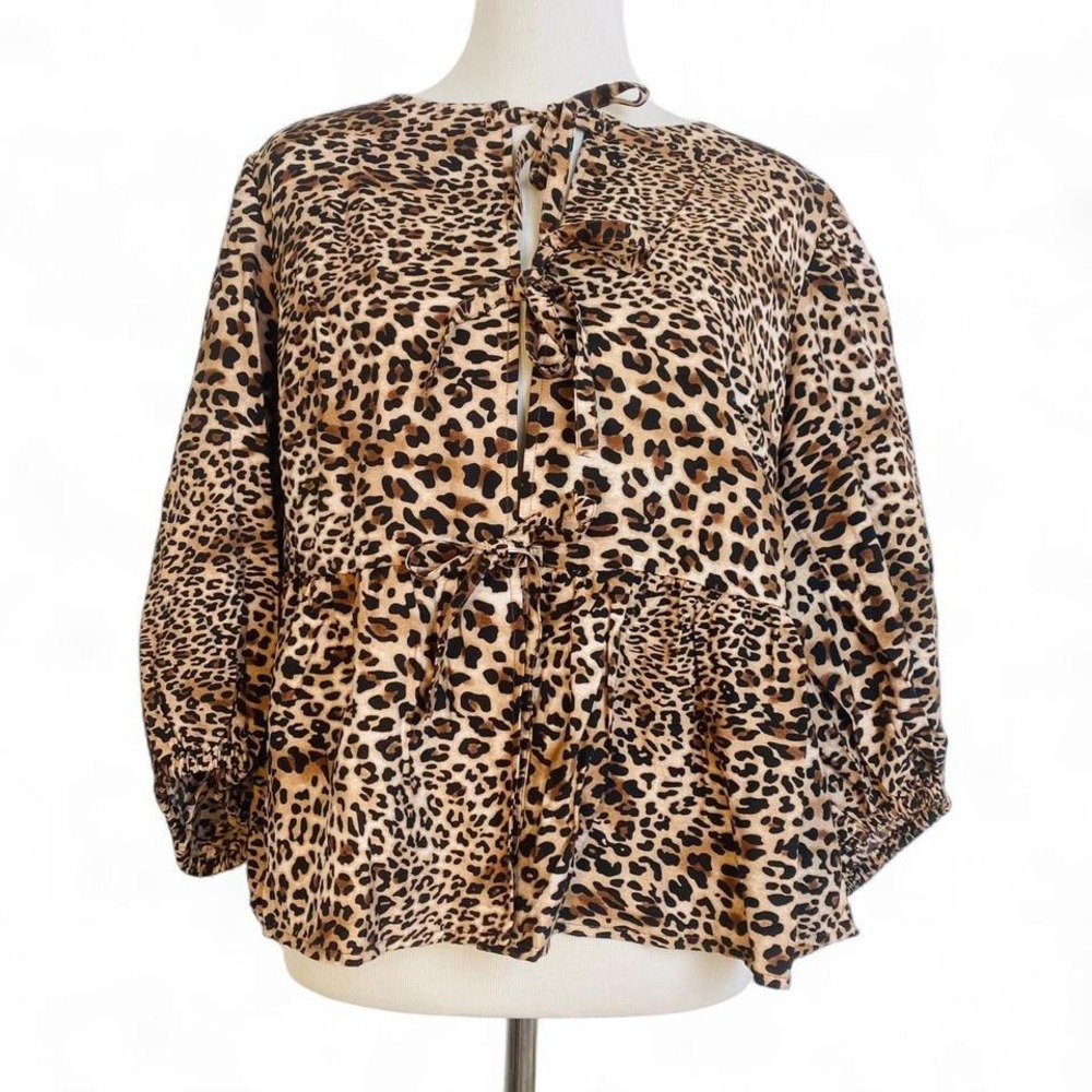 Leopard‎ print tie front blouse.